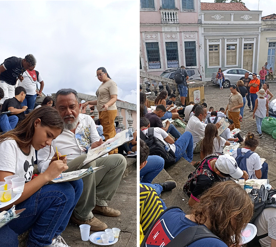 Artista soter carreiro com alunos na escadaria da igreja sfpg.